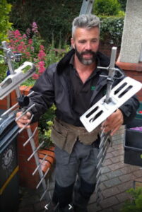 Steve Parker carrying a new Aerial for Installation in Bristol